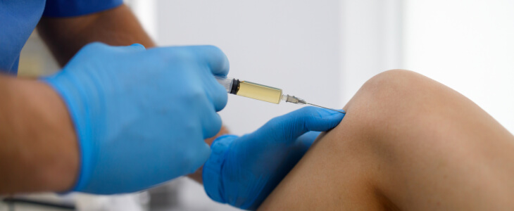 woman getting prp injection in the knee