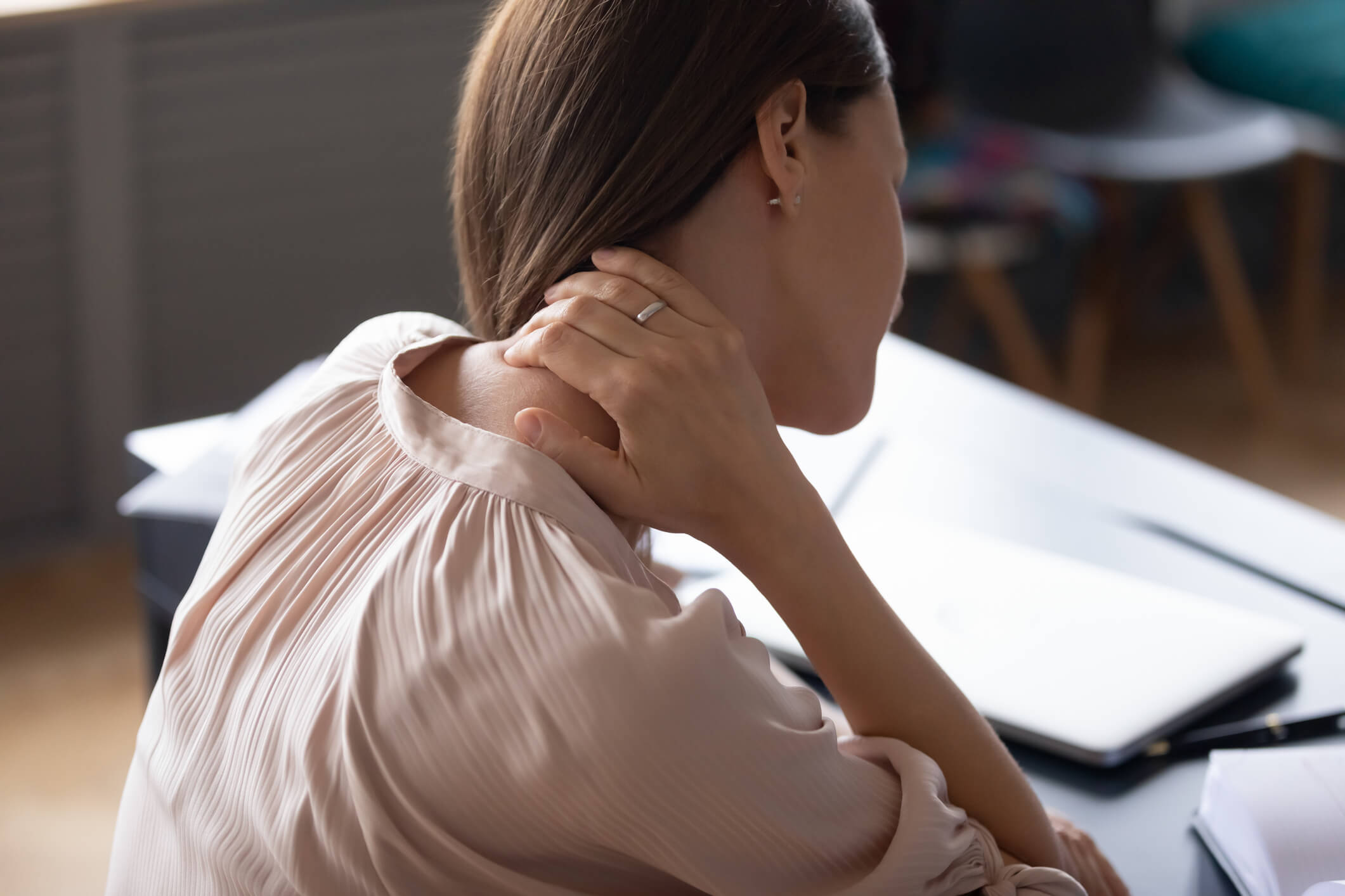 Woman with a pinched nerve in the neck.