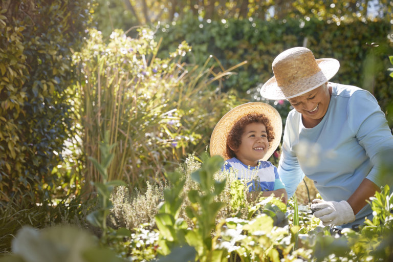 grandson and grandmother gardening