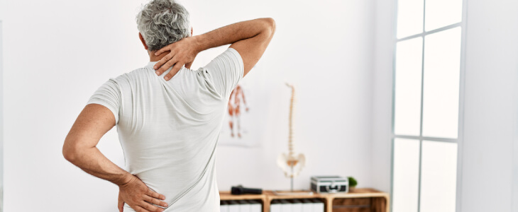 Man doing physical therapy for back pain