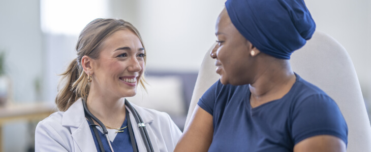 Female pain management doctor with female patient