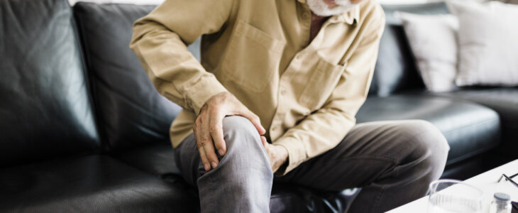 A distraught senior man feeling unwell
