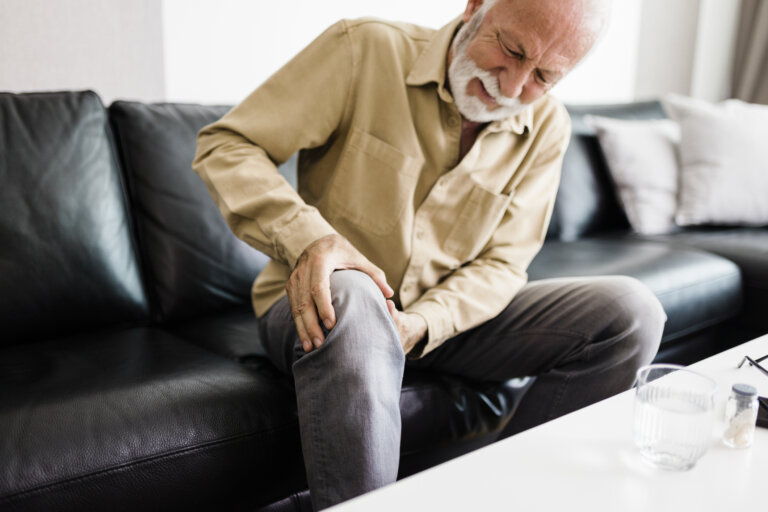 A distraught senior man feeling unwell