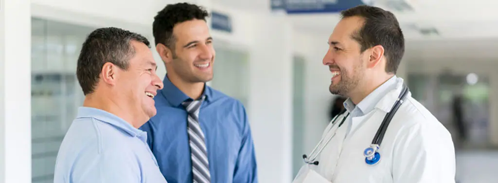 Doctors discussing PEMF therapy with patient